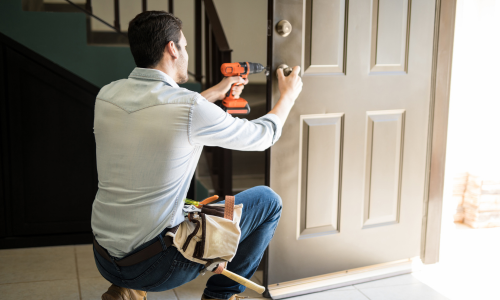 Man installing door lock