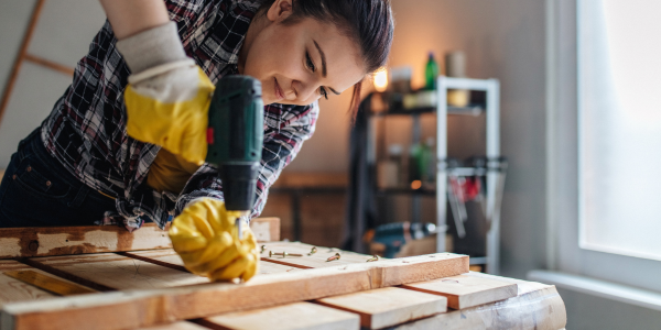 Woman using power drill